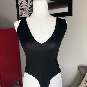 Black lower cut bodysuit Pretty Little Thing
